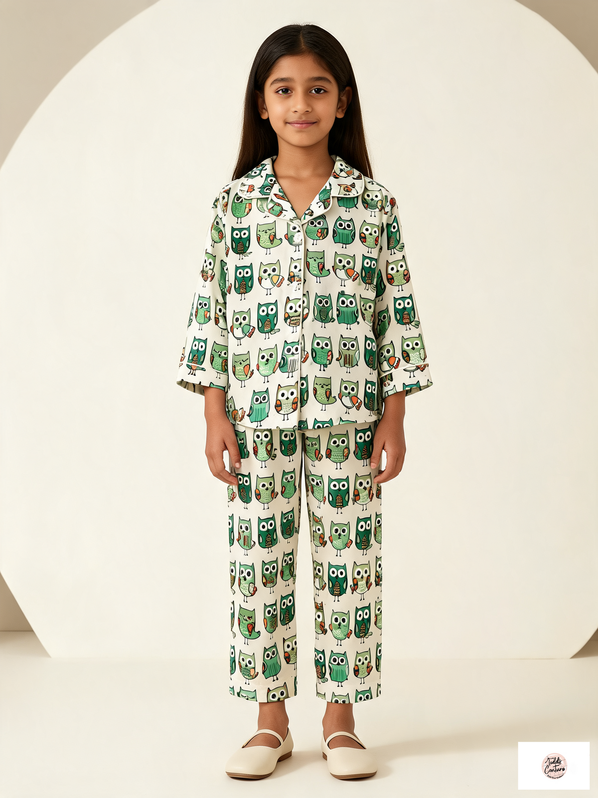 Night Owls night suit worn by a child, front view